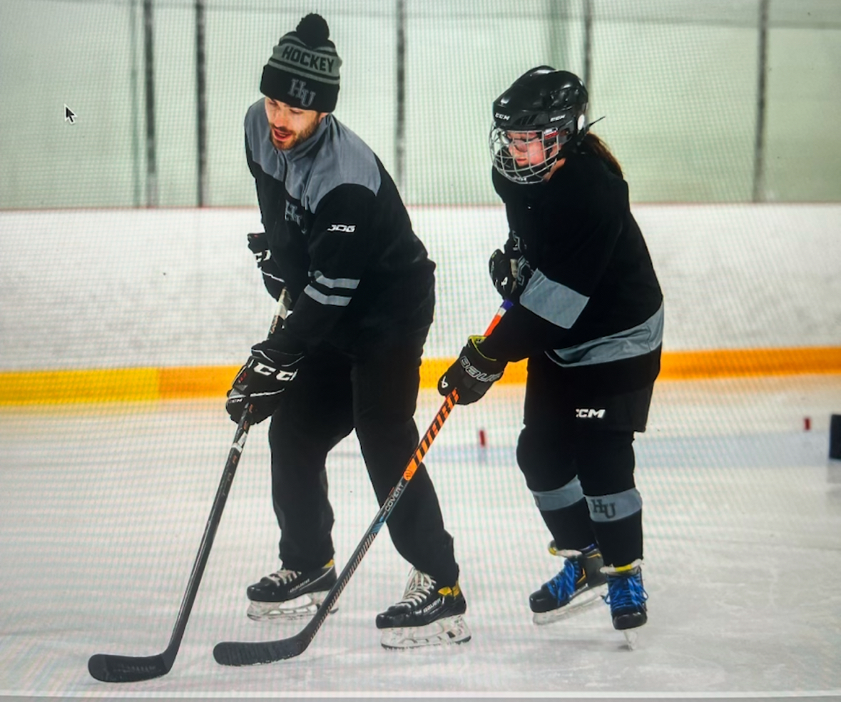 Candid moment of Kyte coaching a young student-athlete